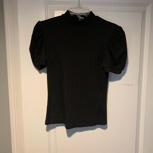 Black short sleeve women’s or juniors sweater. Size Medium (but runs small)
